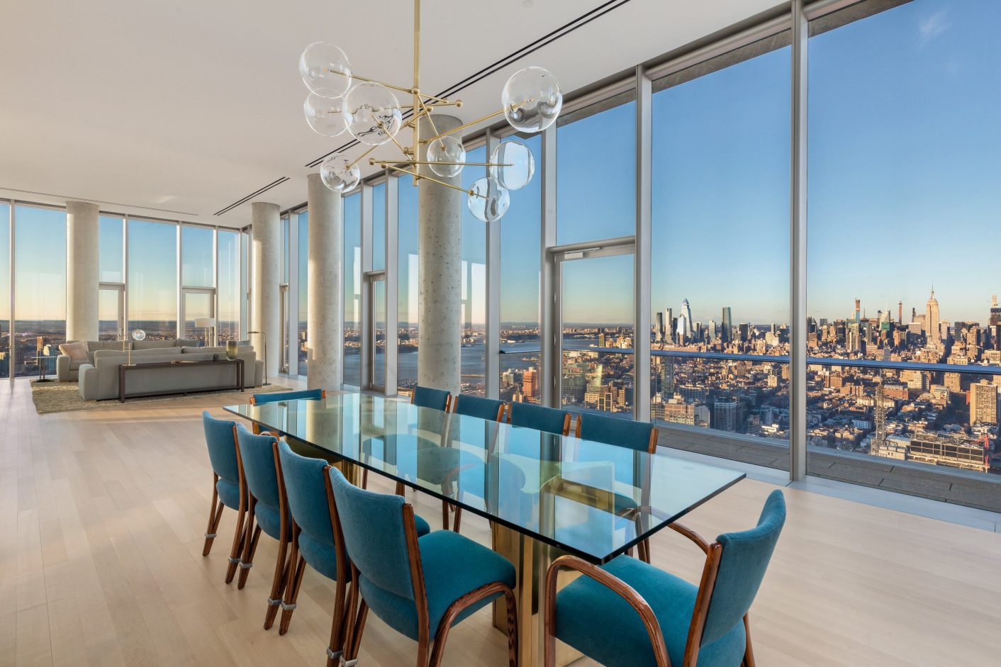 56 Leonard St PH-53 New York, New York INTRODUCING THE LARGEST PENTHOUSE IN 56 LEONARD
Towering over downtown Manhattan, this penthouse in the sky is perched atop the iconic 56 Leonard Street, a pillar of historic Tribeca. The home's 360 degree views of Manhattan are unrivaled and indescribable. Spanning 6,400 square feet of space and three private terraces, this distinctive residence is the largest floor plate in the building.
Through a private key-locked elevator, enter the 53rd floor where you are welcomed by soaring 14-foot ceilings and walls of windows. This glass enclosed chateau reveals a backdrop of Manhattan stretching north, east, west, and south. The lavish great room is flanked by a wood-burning fireplace and west-facing terrace with sweeping water views.
Wrapping around to the right of the great room is a formal dining area with breathtaking northern views all the way up to the Empire State Building. Continuing past the dining area is an enormous chef's kitchen, uniquely crafted by Herzog & de Meuron featuring an Absolute Black granite grand piano-shaped island and custom-sculpted fully-vented range hood. Satin-glass etched cabinetry surrounds a modern selection of premium Miele and Sub-Zero appliances. Off the kitchen and dining areas is an unprecedented 1,000+ square foot wraparound terrace where one can throw extravagant parties and ogle the staggering views north and east across the city.
Sunlight bounces off the Appalachian white oak flooring throughout the home, illuminating all four bedrooms and showcasing a superb, unparalleled design. The master suite revels in the beauty of the city below, with triple exposures north, east, and south offering jaw-dropping views of the East River and One World Trade Center. The expansive 17 x 36 bedroom features a seating area, three large walk-in closets, an en-suite bath, and access to the wraparound terrace. The five-piece master bath is appointed with travertine floors and Thassos marble mosaic tile walls. The Herzog & de Meuron custom design includes a double sink vanity, free-standing tub, six-by-four foot glass enclosed steam shower, heated flooring, and a full height mirrored closet. Awaken to the sunrise, take a bath while admiring one of the world's most iconic buildings, and gaze at the stars from your balcony.
Three additional bedroom suites line the south-facing wing of the apartment, each complete with luxurious en-suite bathrooms and one with its own private balcony.
This gracious residence also includes an extra bonus room/exercise room, powder room, and laundry room with a Maytag washer and dryer.
Tribeca's cantilevered 60-story glass tower designed by Herzog & de Meuron has become a defining landmark along Manhattan's skyline. The full-service condominium boasts over 17,000 square feet of amenities include a fitness center and yoga room, a 75-foot pool with adjacent sun deck, a steam room, a solid Red Cedar wood sauna, an indoor/outdoor theatre, a private dining room and catering kitchen, a library/lounge, children's playroom, bicycle storage, full-time doorman, on-site resident manager, and live-in super. A parking spot and storage are included at a monthly fee of $683/month.